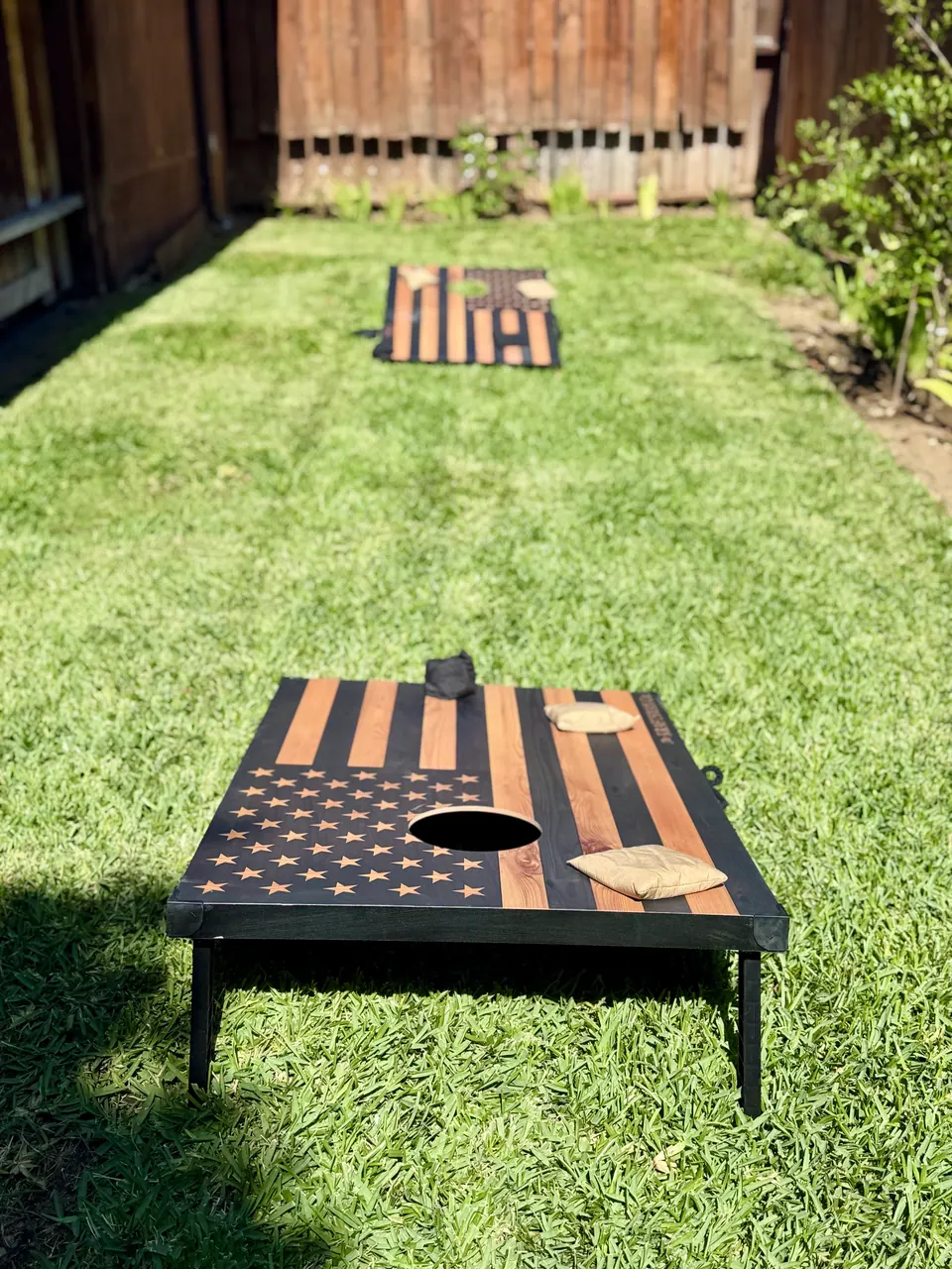 Cornhole board on the lawn