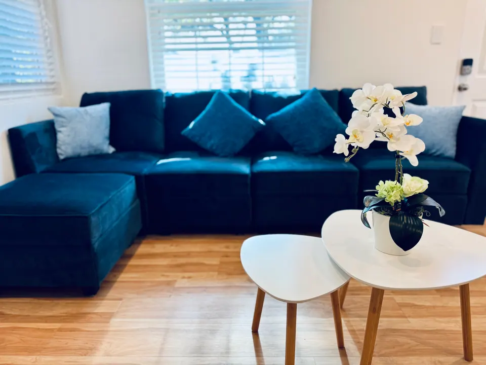 Navy sectional with nesting coffee tables