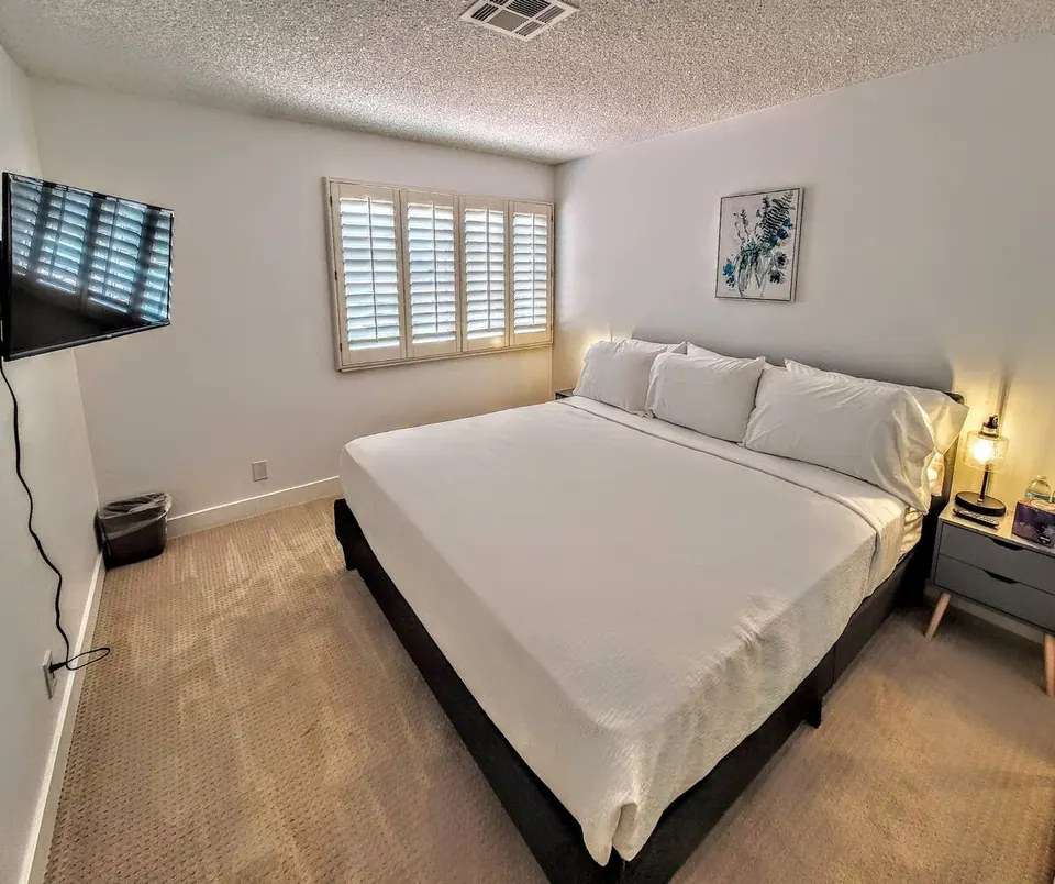 Bedroom with king bed and TV