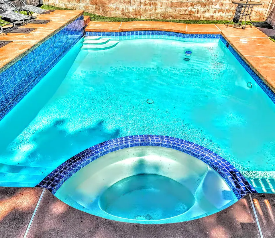 Pool with attached spa
