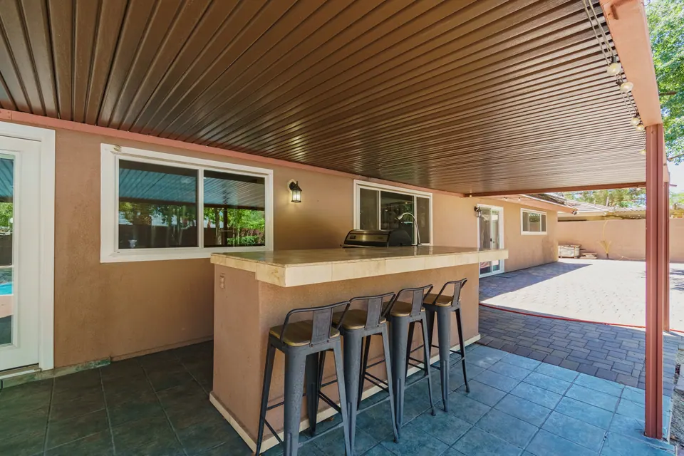 Covered patio with outdoor bar seating