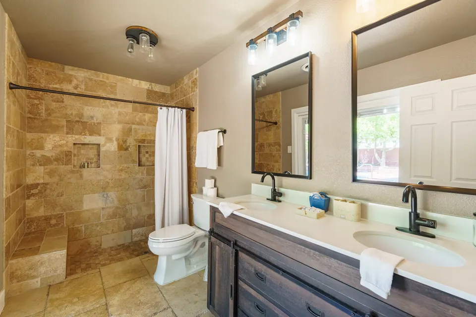 Double-vanity bathroom with walk-in shower
