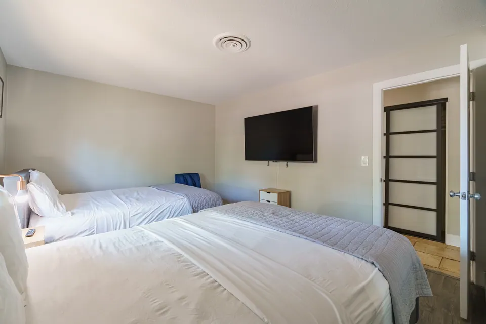 Bedroom 3 with wall-mounted TV