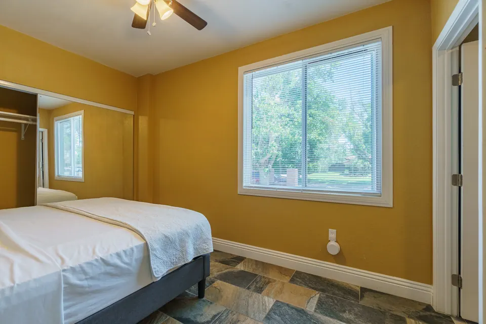 Bedroom 5 with large garden window