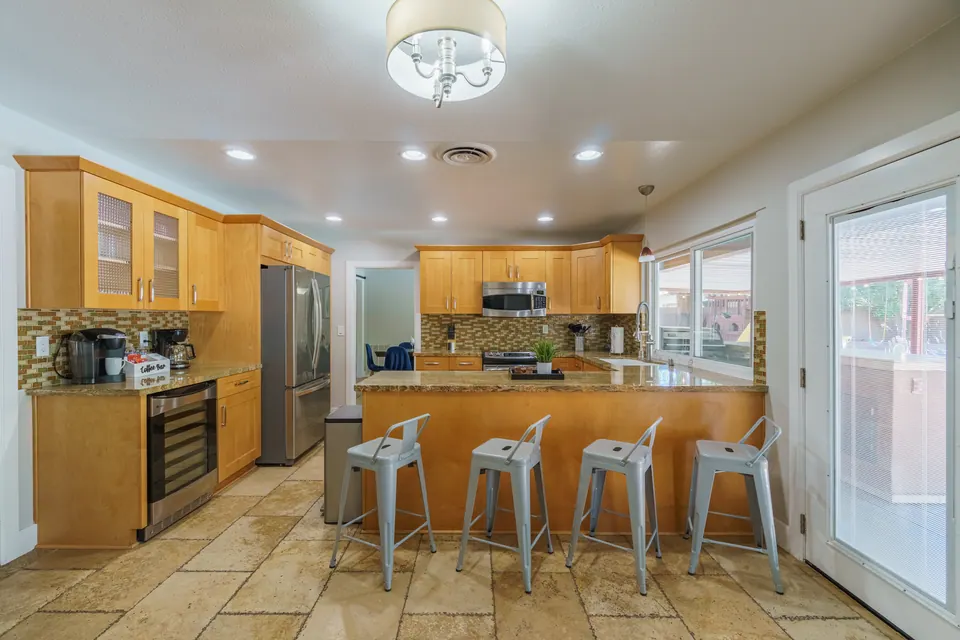 Kitchen with breakfast bar and stainless appliances