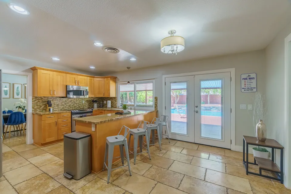 Kitchen island opening to the backyard