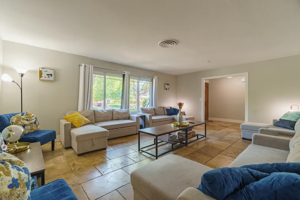 Living room seating area with large windows