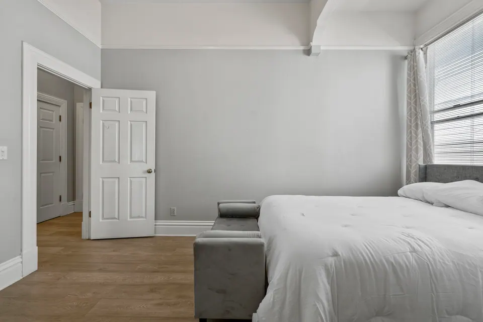 Bedroom with seating and closet