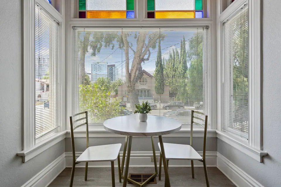 Bistro table in the stained-glass bay window