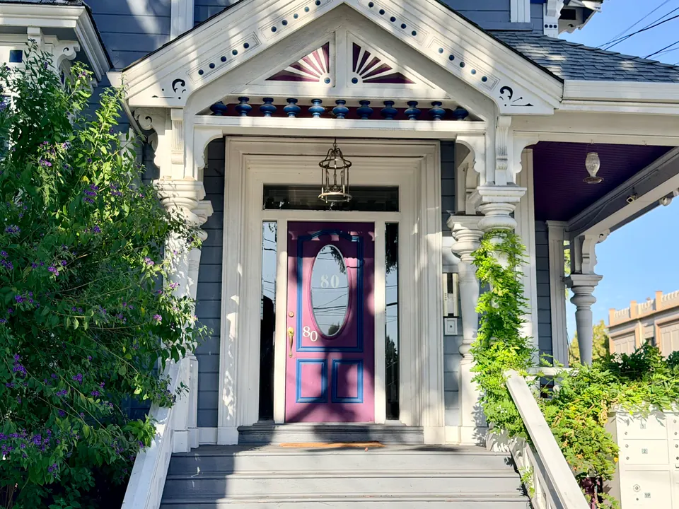 Ornate front entry with stained-glass door